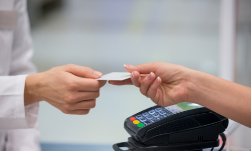 Customer handing cashier card